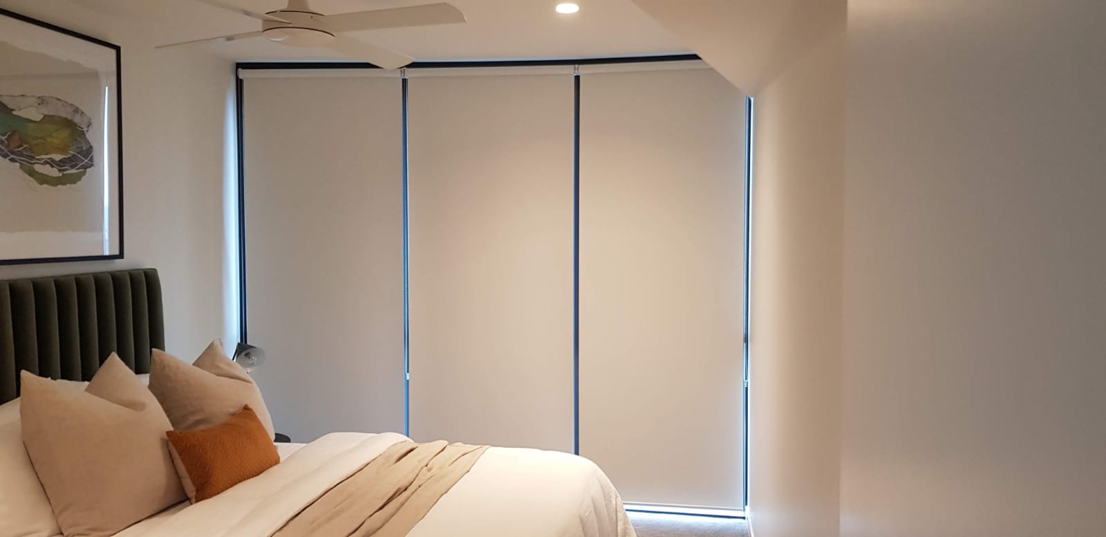 Blockout roller blinds in a bedroom