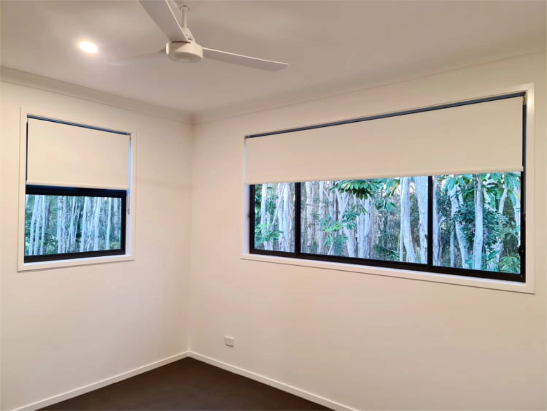 Roller blinds in a bedroom