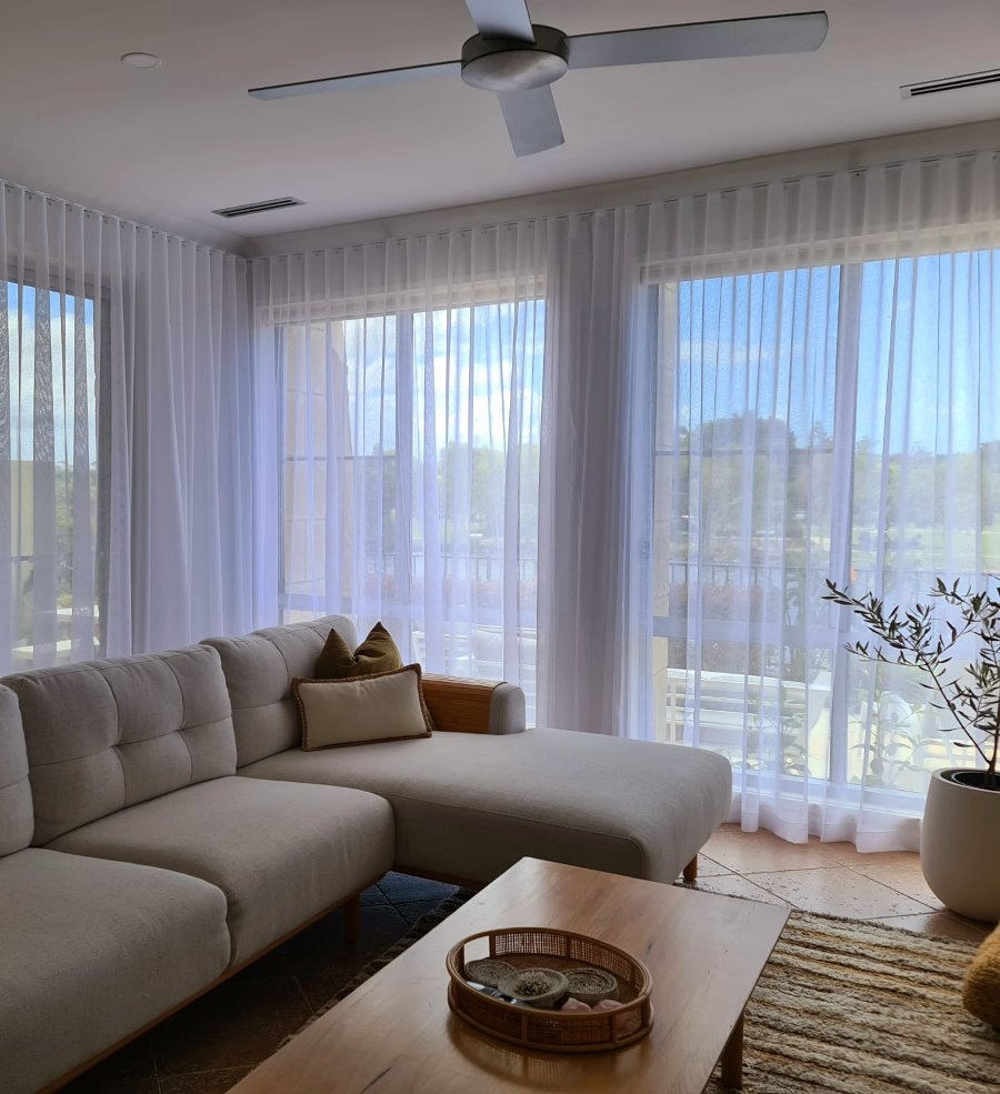 Sheer curtains in a Mermaid Waters dining room