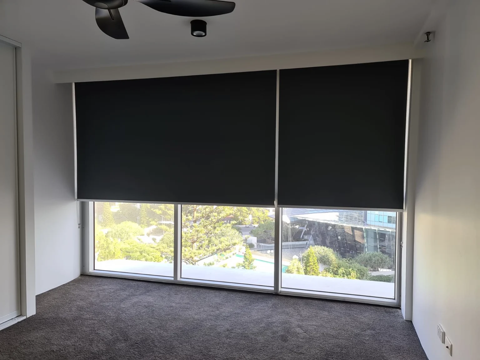 Blockout roller blinds in a Southport bedroom