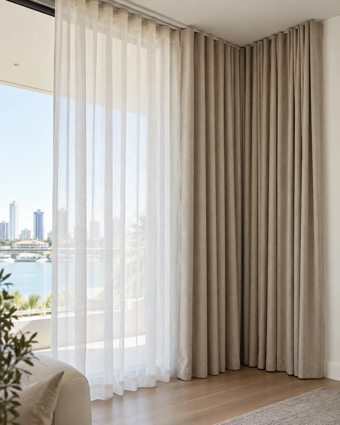 Layered blockout and sheer curtains fitted to a ceiling-mounted double track