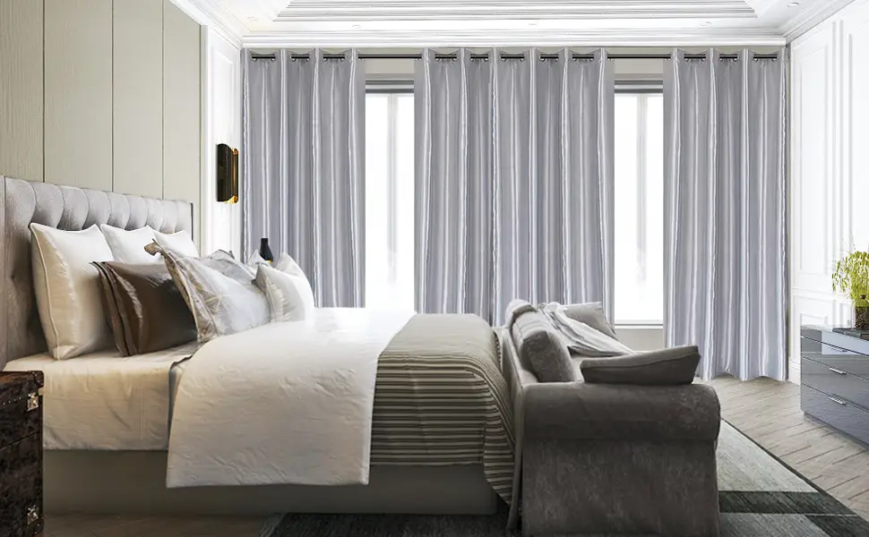 White blockout curtains fitted in a calm bedroom