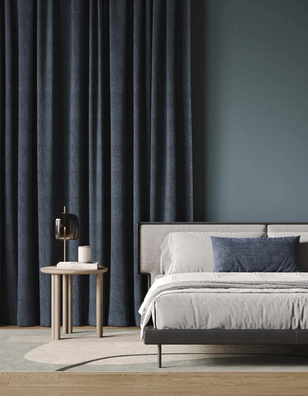 Navy blockout curtains beside a bed in a modern bedroom