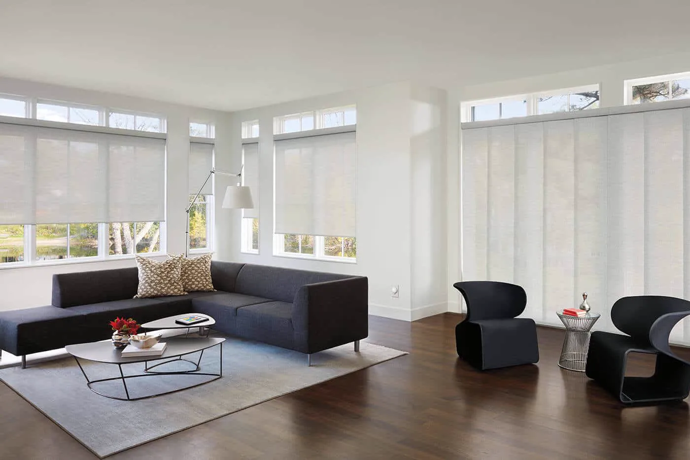 Panel glide blinds fitted across wide windows in a modern living room