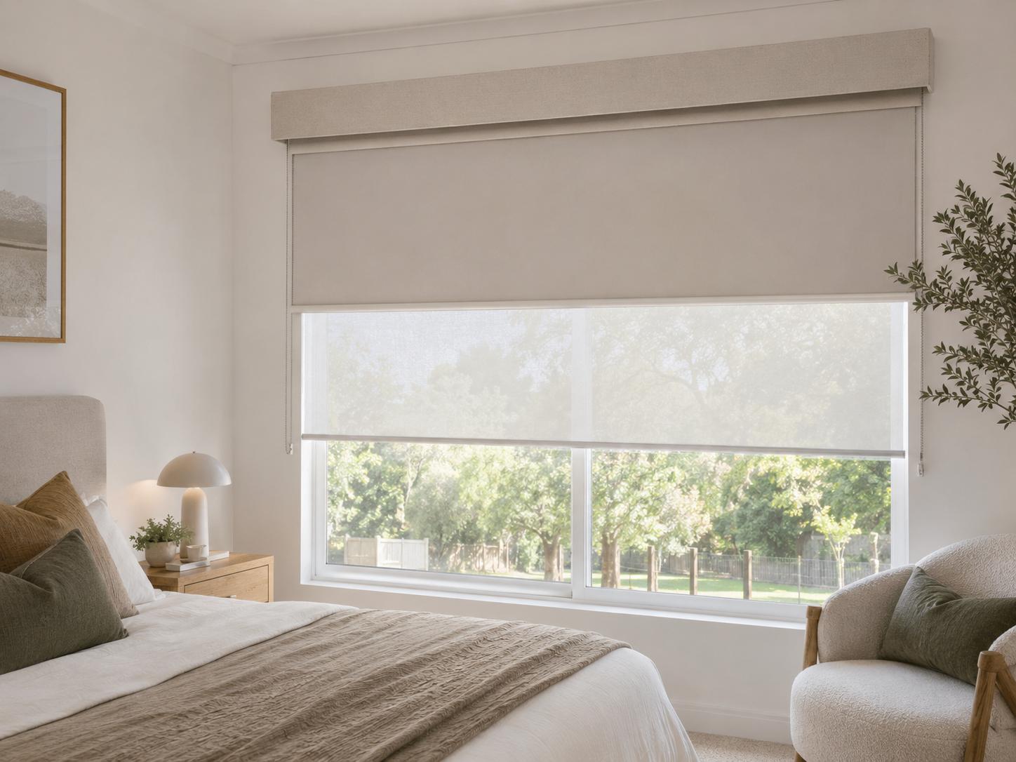Double roller blinds combining blockout and light-filtering fabrics in a neutral bedroom