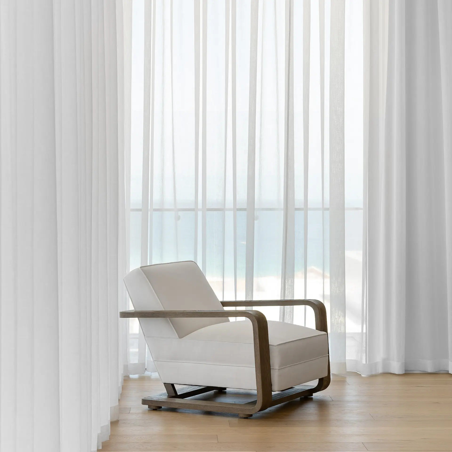 White sheer curtains in a coastal living room