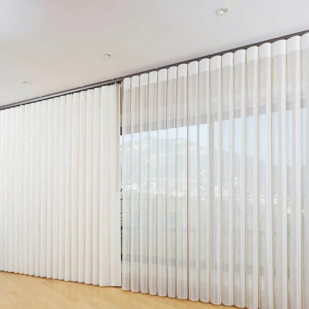 White Veri Shades fitted across wide glass doors in a modern living room